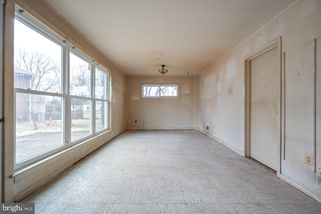 unfurnished room featuring light floors