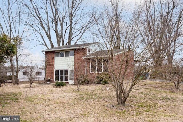 view of front of home with brick siding