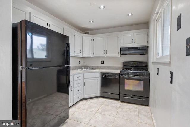 kitchen featuring under cabinet range hood, white cabinetry, black appliances, and light countertops