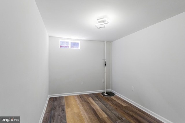 interior space with dark wood-style floors and baseboards