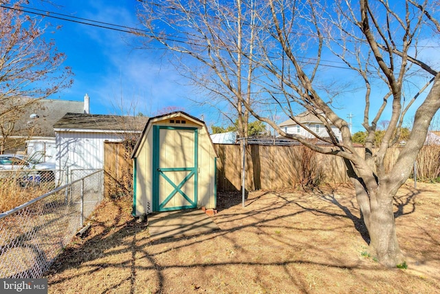 view of shed with a fenced backyard