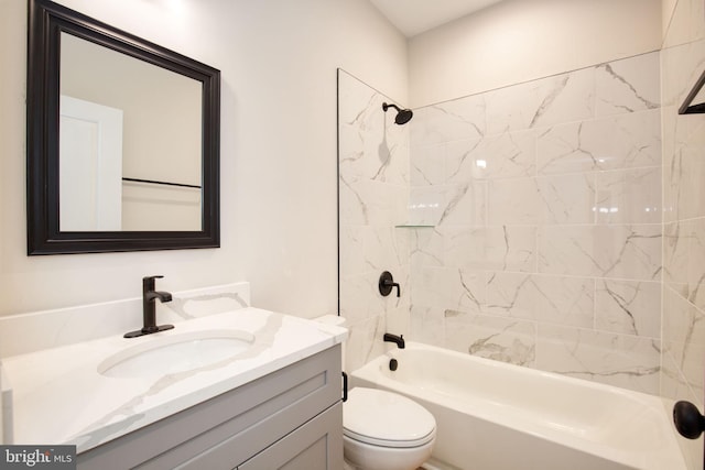 full bathroom featuring toilet, vanity, and  shower combination