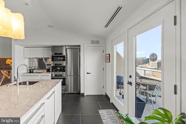 kitchen featuring french doors, visible vents, appliances with stainless steel finishes, and a sink