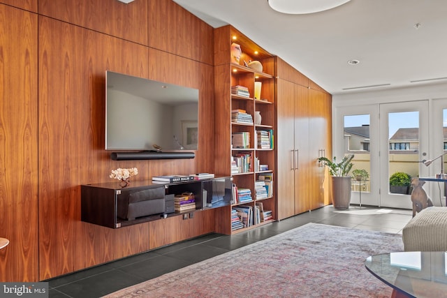 tiled living area with wood walls