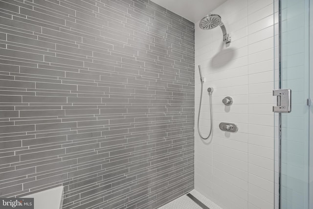 bathroom with a shower stall