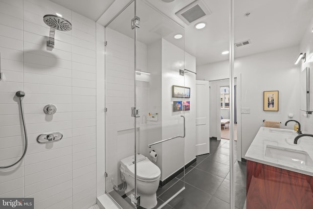 full bathroom with tile patterned floors, visible vents, a shower stall, and a sink