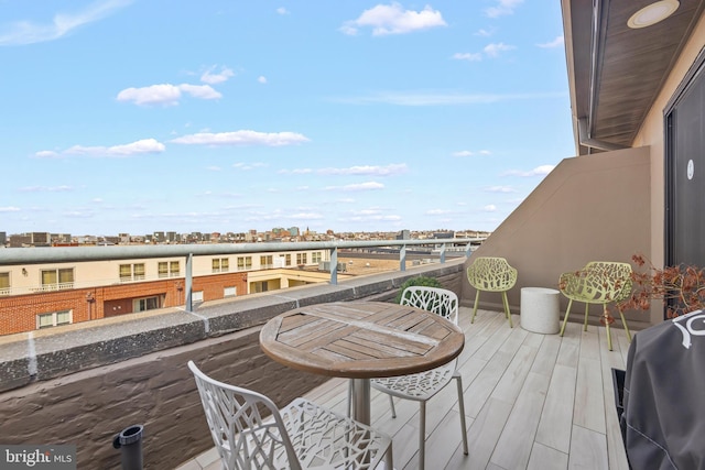 balcony with a city view and a grill