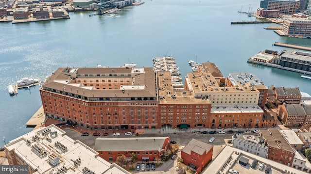 birds eye view of property with a water view and a view of city