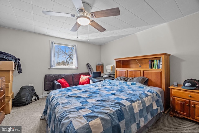 carpeted bedroom featuring a ceiling fan