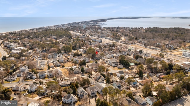 drone / aerial view with a residential view and a water view