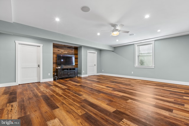 unfurnished living room with ceiling fan, recessed lighting, dark wood-style flooring, and baseboards