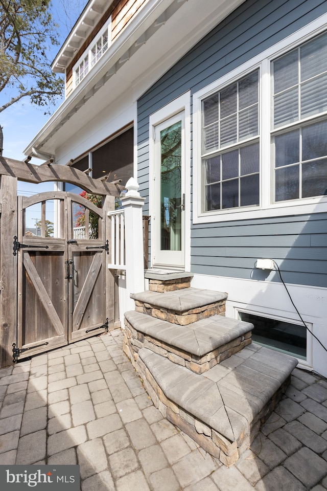 view of patio with a gate