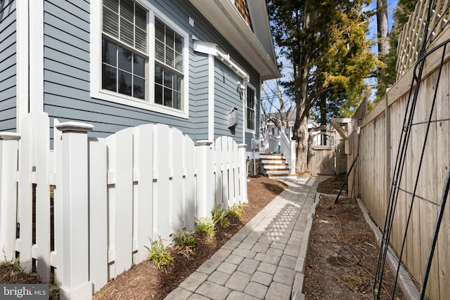 view of property exterior with a fenced backyard