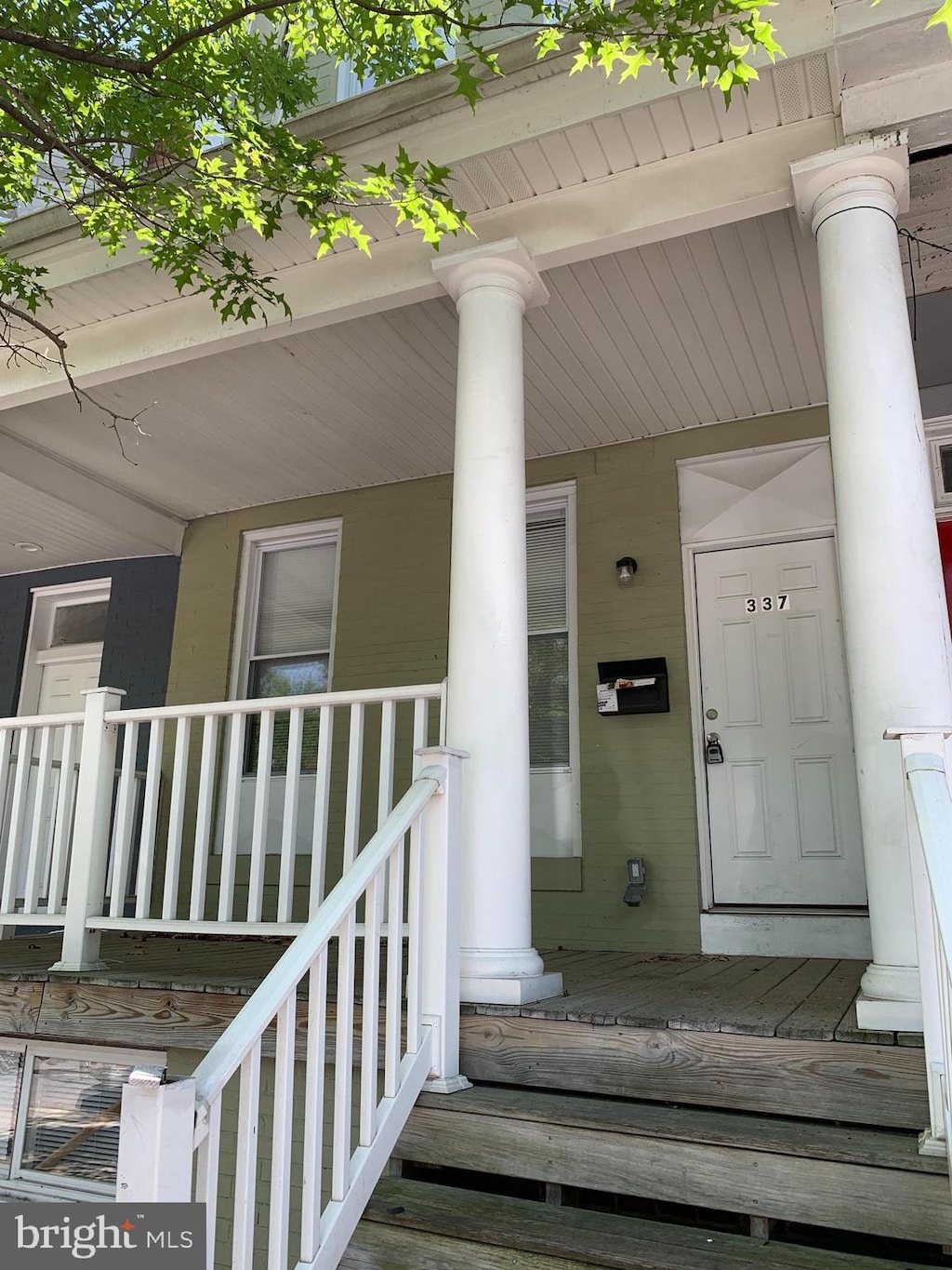 doorway to property with a porch