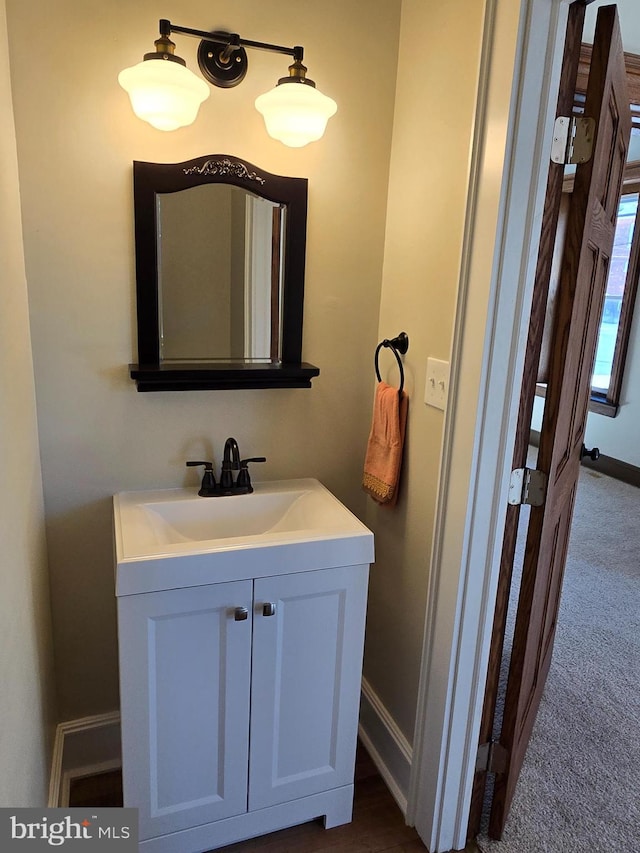 bathroom featuring baseboards and vanity