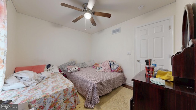 bedroom featuring visible vents and ceiling fan