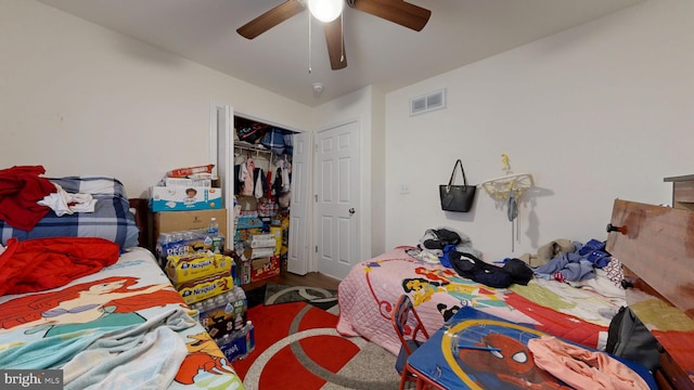 bedroom with visible vents, a closet, and ceiling fan