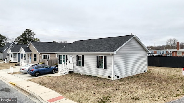 single story home with fence, roof with shingles, and crawl space