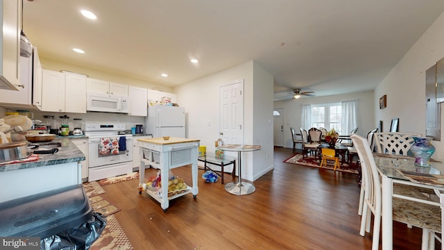 kitchen with white appliances, recessed lighting, dark wood-style flooring, ceiling fan, and white cabinetry