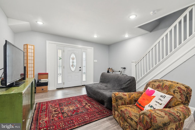 foyer entrance with recessed lighting, baseboards, and wood finished floors