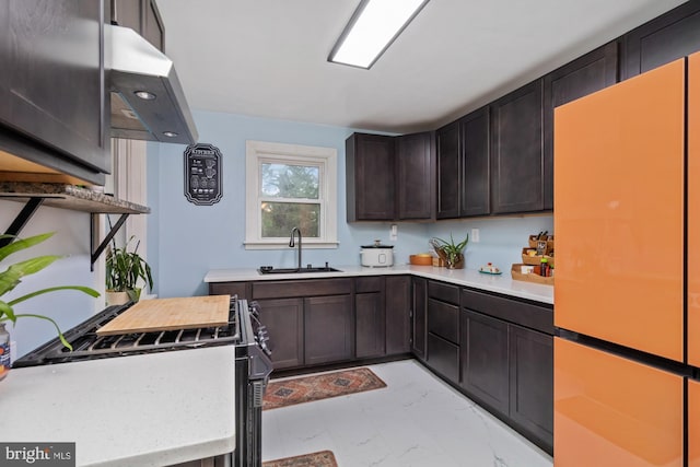 kitchen featuring ventilation hood, a sink, light countertops, dark brown cabinets, and marble finish floor