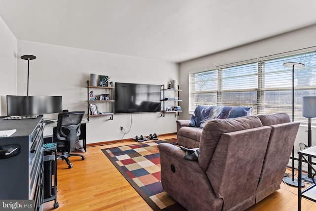 living room featuring light wood-style floors and baseboards