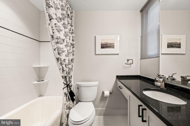 full bath with toilet, shower / tub combo, tile patterned flooring, baseboards, and vanity