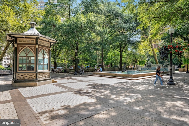 view of property's community featuring a pool and a patio area