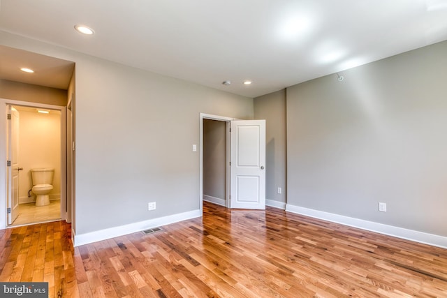 unfurnished bedroom with visible vents, recessed lighting, baseboards, and light wood finished floors