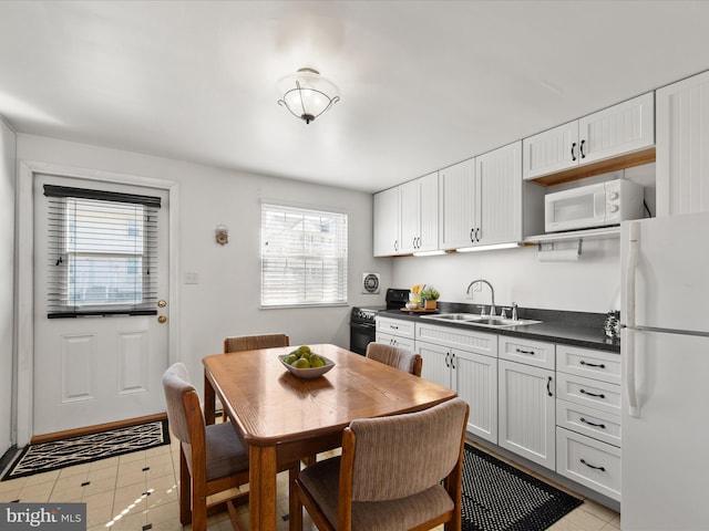 dining space featuring light tile patterned flooring