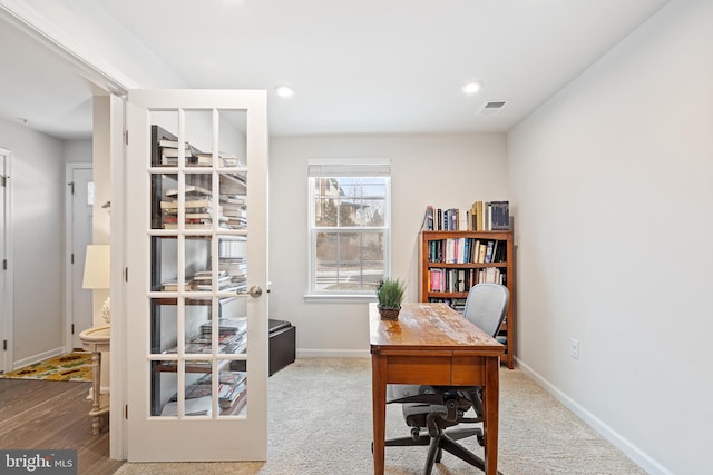 office space with recessed lighting, baseboards, visible vents, and french doors