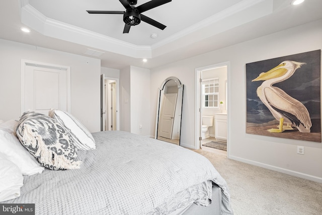 bedroom with crown molding, baseboards, carpet, a tray ceiling, and recessed lighting