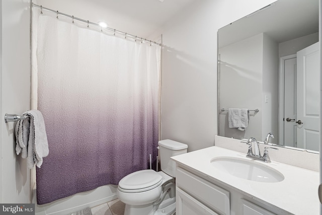 full bath featuring vanity, tile patterned floors, toilet, and shower / tub combo with curtain