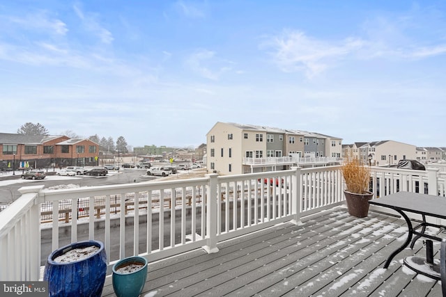 wooden deck featuring a residential view