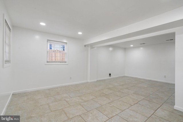 below grade area featuring visible vents, recessed lighting, and baseboards