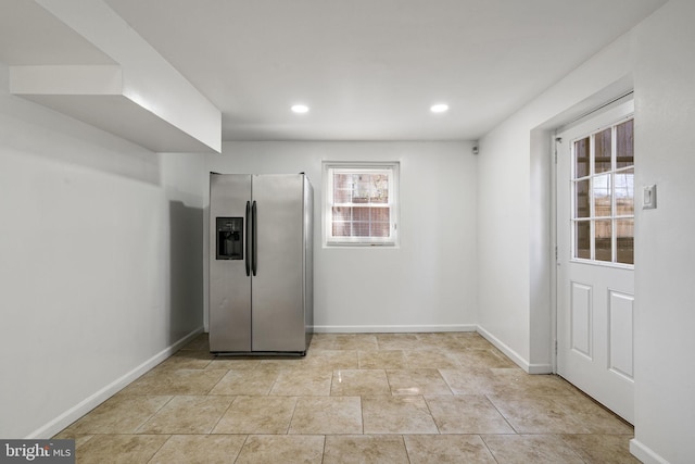 interior space featuring recessed lighting and baseboards