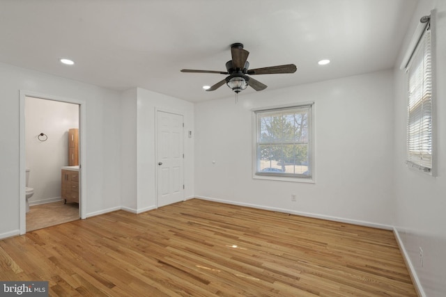 unfurnished bedroom with multiple windows, recessed lighting, and light wood finished floors