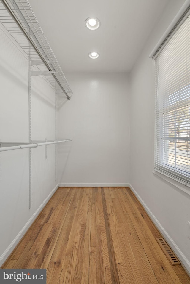 spacious closet with wood finished floors