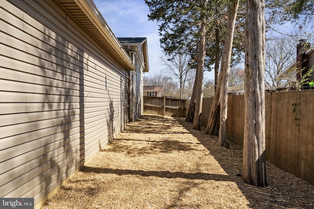 view of side of property featuring a fenced backyard