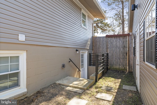 view of property exterior with fence