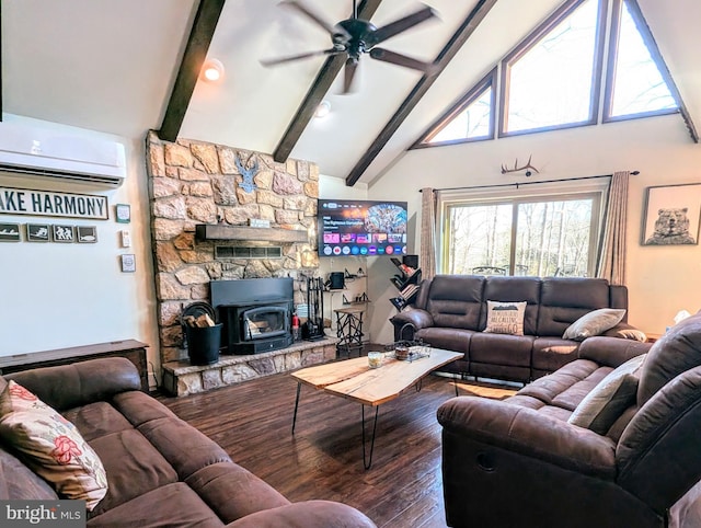 living area with beam ceiling, a wall mounted air conditioner, a ceiling fan, and wood finished floors