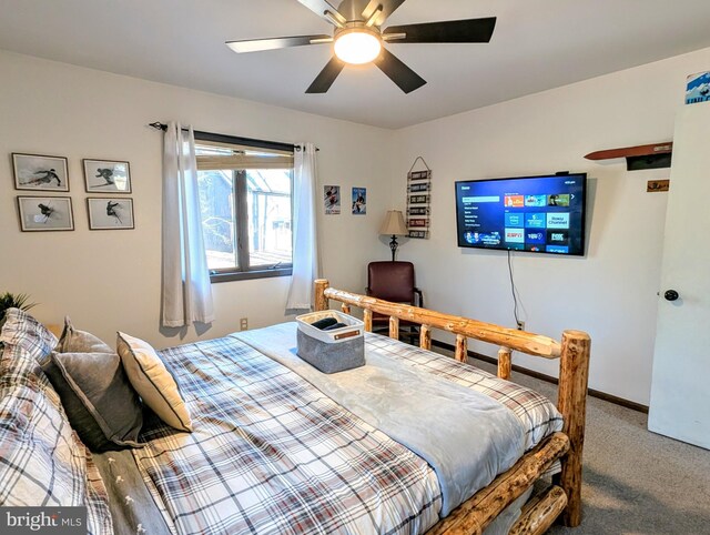 bedroom with baseboards, carpet, and ceiling fan