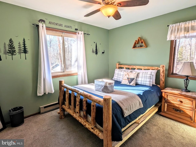 bedroom featuring a baseboard heating unit, baseboards, carpet, and ceiling fan