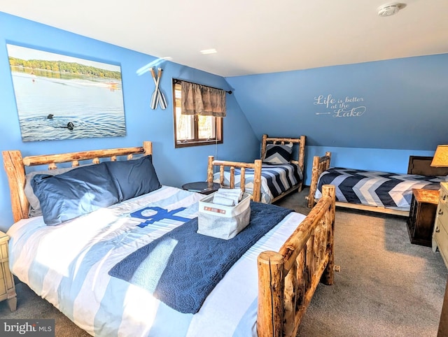 carpeted bedroom with vaulted ceiling