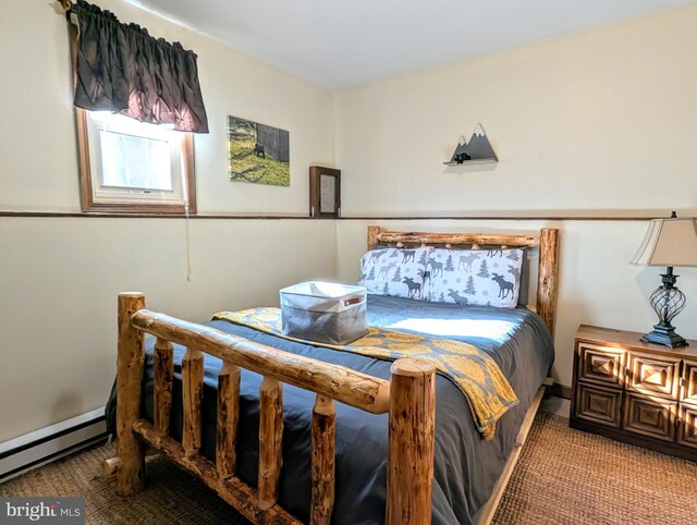 bedroom featuring baseboard heating and light carpet