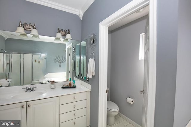 full bathroom featuring a shower stall, crown molding, baseboards, toilet, and vanity