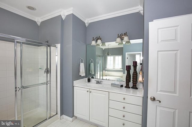 full bathroom with vanity, a shower stall, and ornamental molding