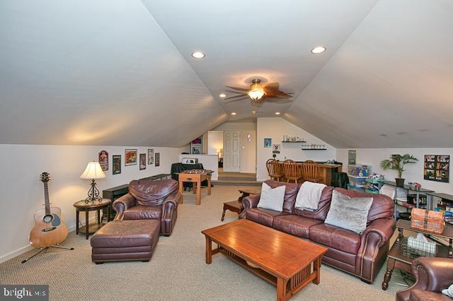 carpeted living room with recessed lighting, baseboards, and vaulted ceiling