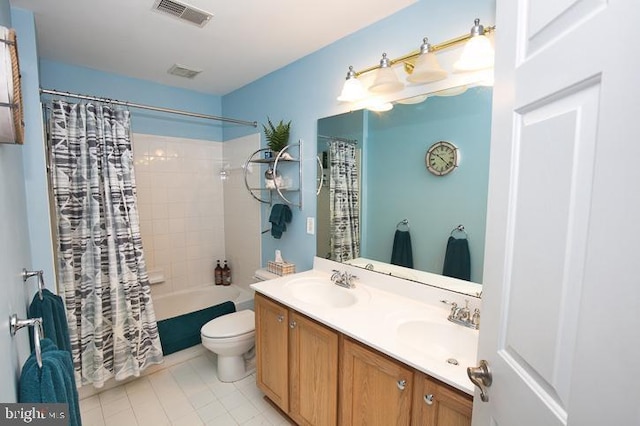 full bath with double vanity, visible vents, toilet, and a sink