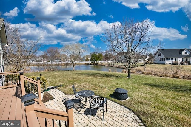 view of yard featuring a patio area and a water view